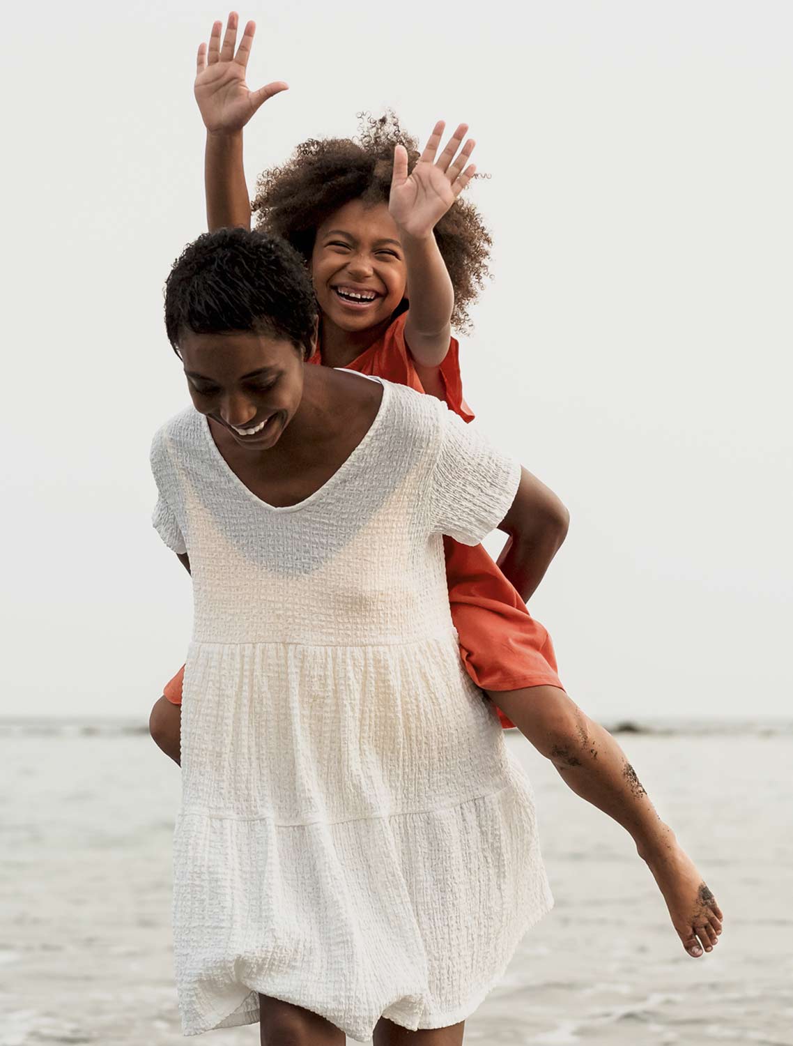 Happy mother and daughter playing after going to therapy together